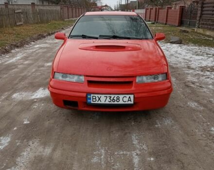 Красный Опель Калибра, объемом двигателя 2 л и пробегом 120 тыс. км за 1399 $, фото 1 на Automoto.ua