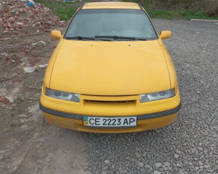 Желтый Опель Калибра, объемом двигателя 2 л и пробегом 300 тыс. км за 1500 $, фото 1 на Automoto.ua