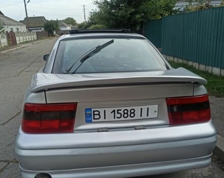 Сірий Опель Калібра, об'ємом двигуна 2 л та пробігом 317 тис. км за 2700 $, фото 4 на Automoto.ua