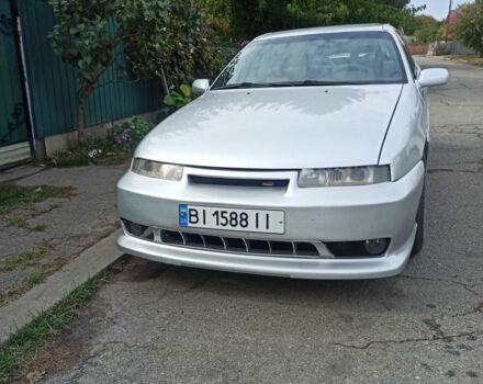 Сірий Опель Калібра, об'ємом двигуна 2 л та пробігом 317 тис. км за 2700 $, фото 7 на Automoto.ua