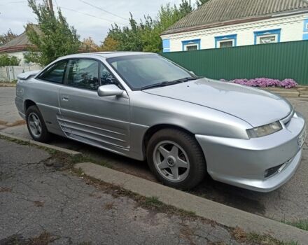 Сірий Опель Калібра, об'ємом двигуна 2 л та пробігом 317 тис. км за 2700 $, фото 3 на Automoto.ua