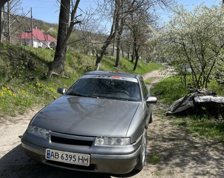 Серый Опель Калибра, объемом двигателя 2 л и пробегом 233 тыс. км за 2999 $, фото 1 на Automoto.ua
