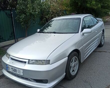 Серый Опель Калибра, объемом двигателя 2 л и пробегом 317 тыс. км за 2700 $, фото 1 на Automoto.ua