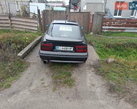 Серый Опель Калибра, объемом двигателя 2 л и пробегом 338 тыс. км за 2840 $, фото 1 на Automoto.ua