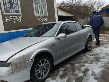 Серый Опель Калибра, объемом двигателя 2.5 л и пробегом 250 тыс. км за 2550 $, фото 1 на Automoto.ua