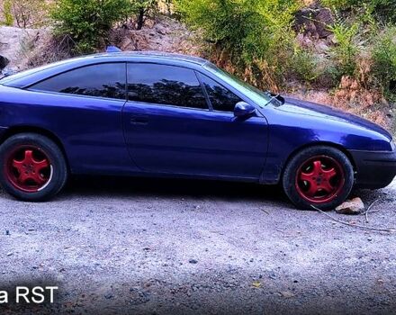 Синій Опель Калібра, об'ємом двигуна 2 л та пробігом 255 тис. км за 2000 $, фото 2 на Automoto.ua