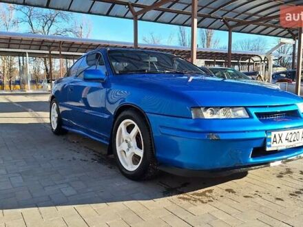 Синий Опель Калибра, объемом двигателя 2 л и пробегом 280 тыс. км за 2500 $, фото 1 на Automoto.ua