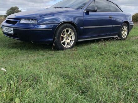 Синий Опель Калибра, объемом двигателя 2 л и пробегом 300 тыс. км за 3000 $, фото 1 на Automoto.ua