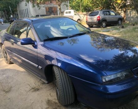 Синий Опель Калибра, объемом двигателя 2.5 л и пробегом 270 тыс. км за 3200 $, фото 1 на Automoto.ua