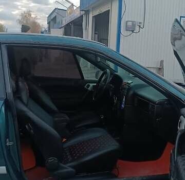 Зеленый Опель Калибра, объемом двигателя 2 л и пробегом 365 тыс. км за 2200 $, фото 3 на Automoto.ua