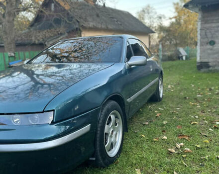 Зелений Опель Калібра, об'ємом двигуна 2 л та пробігом 300 тис. км за 2700 $, фото 7 на Automoto.ua