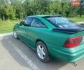 Зелений Опель Калібра, об'ємом двигуна 2 л та пробігом 300 тис. км за 1500 $, фото 1 на Automoto.ua