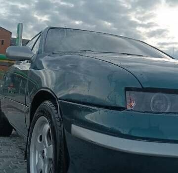 Зеленый Опель Калибра, объемом двигателя 2 л и пробегом 365 тыс. км за 2200 $, фото 1 на Automoto.ua