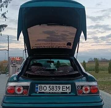 Зеленый Опель Калибра, объемом двигателя 2 л и пробегом 365 тыс. км за 2200 $, фото 4 на Automoto.ua