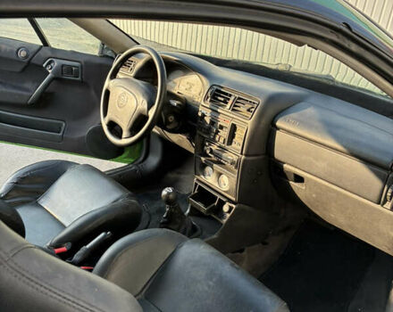 Зеленый Опель Калибра, объемом двигателя 2 л и пробегом 280 тыс. км за 3000 $, фото 10 на Automoto.ua