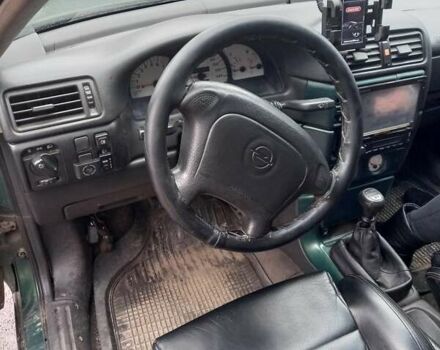 Зелений Опель Калібра, об'ємом двигуна 2 л та пробігом 350 тис. км за 2750 $, фото 8 на Automoto.ua