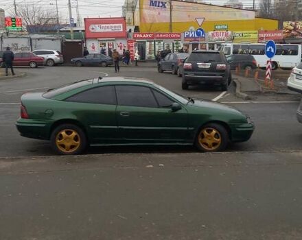 Зелений Опель Калібра, об'ємом двигуна 2 л та пробігом 350 тис. км за 2750 $, фото 5 на Automoto.ua