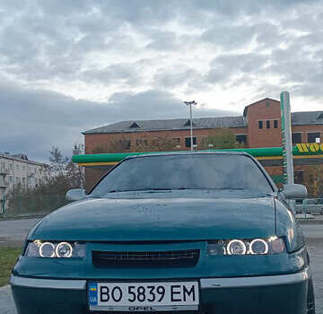 Зелений Опель Калібра, об'ємом двигуна 2 л та пробігом 300 тис. км за 2700 $, фото 1 на Automoto.ua