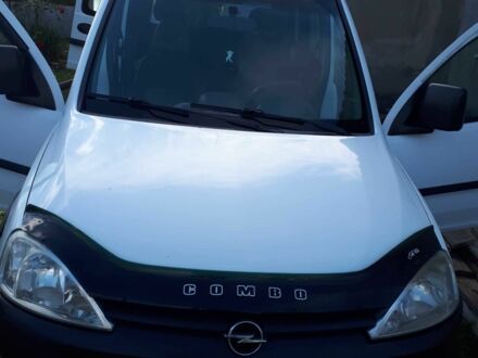 Белый Опель Кампо, объемом двигателя 1.3 л и пробегом 300 тыс. км за 3500 $, фото 1 на Automoto.ua