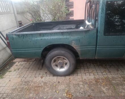 Зеленый Опель Кампо, объемом двигателя 2 л и пробегом 299 тыс. км за 2386 $, фото 2 на Automoto.ua