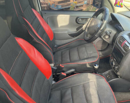 Белый Опель Комбо груз.-пасс., объемом двигателя 1.25 л и пробегом 300 тыс. км за 4000 $, фото 2 на Automoto.ua