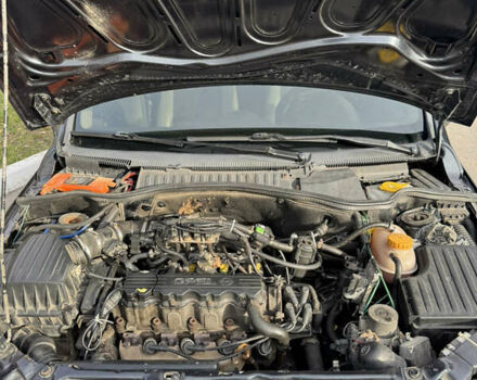 Черный Опель Комбо груз.-пасс., объемом двигателя 2 л и пробегом 334 тыс. км за 3500 $, фото 8 на Automoto.ua