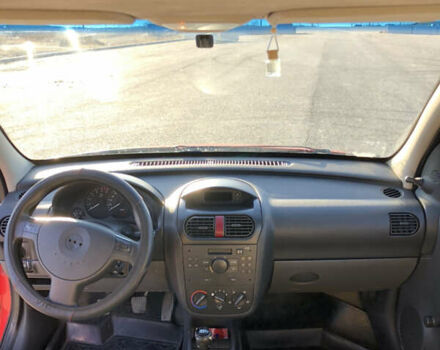 Красный Опель Комбо груз.-пасс., объемом двигателя 1.25 л и пробегом 200 тыс. км за 2650 $, фото 4 на Automoto.ua