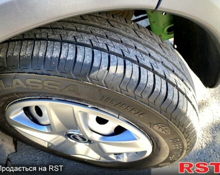 Зеленый Опель Комбо груз.-пасс., объемом двигателя 1.2 л и пробегом 255 тыс. км за 4500 $, фото 3 на Automoto.ua