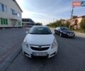 Белый Опель Корса, объемом двигателя 1.23 л и пробегом 166 тыс. км за 3600 $, фото 1 на Automoto.ua