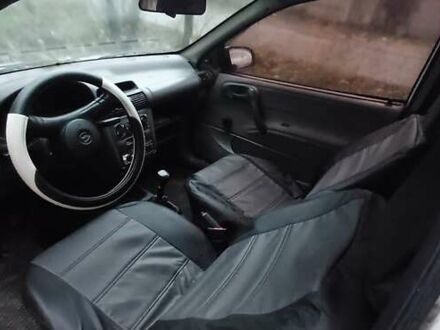 Белый Опель Корса, объемом двигателя 1.2 л и пробегом 450 тыс. км за 1179 $, фото 1 на Automoto.ua