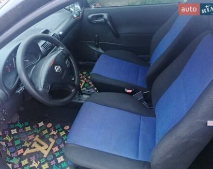 Черный Опель Корса, объемом двигателя 1.2 л и пробегом 235 тыс. км за 2200 $, фото 5 на Automoto.ua