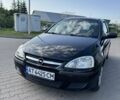 Черный Опель Корса, объемом двигателя 1 л и пробегом 140 тыс. км за 2300 $, фото 1 на Automoto.ua