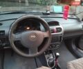 Черный Опель Корса, объемом двигателя 1.2 л и пробегом 232 тыс. км за 2700 $, фото 6 на Automoto.ua