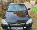 Черный Опель Корса, объемом двигателя 1.2 л и пробегом 220 тыс. км за 3600 $, фото 1 на Automoto.ua