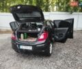 Черный Опель Корса, объемом двигателя 1.25 л и пробегом 200 тыс. км за 4000 $, фото 7 на Automoto.ua