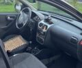 Черный Опель Корса, объемом двигателя 1.2 л и пробегом 280 тыс. км за 3900 $, фото 6 на Automoto.ua