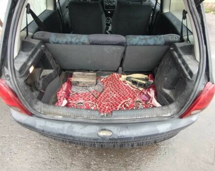 Черный Опель Корса, объемом двигателя 1 л и пробегом 1000 тыс. км за 1100 $, фото 1 на Automoto.ua