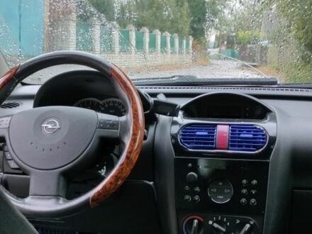 Черный Опель Корса, объемом двигателя 1 л и пробегом 215 тыс. км за 2300 $, фото 1 на Automoto.ua