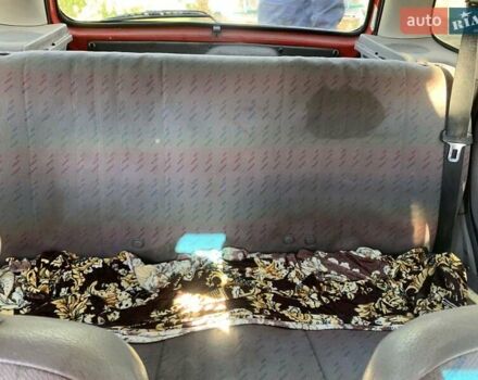 Красный Опель Корса, объемом двигателя 1.2 л и пробегом 285 тыс. км за 1500 $, фото 4 на Automoto.ua