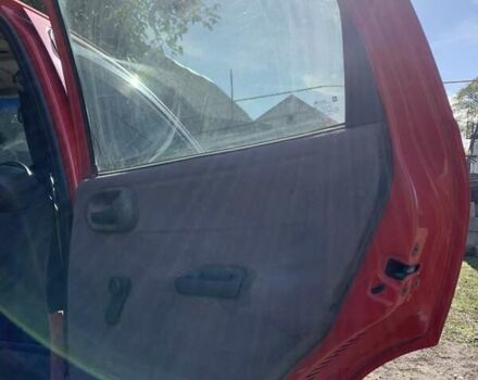 Красный Опель Корса, объемом двигателя 1.2 л и пробегом 285 тыс. км за 1500 $, фото 3 на Automoto.ua