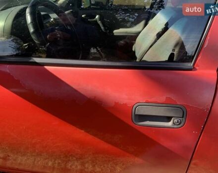 Красный Опель Корса, объемом двигателя 1.2 л и пробегом 285 тыс. км за 1500 $, фото 6 на Automoto.ua