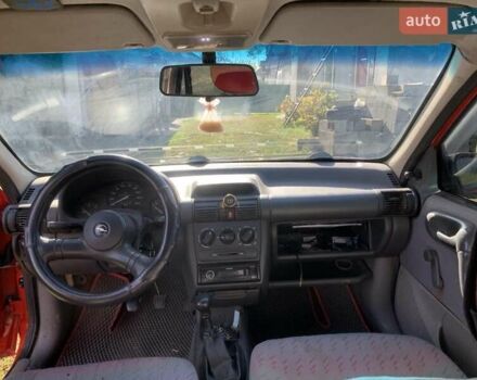 Красный Опель Корса, объемом двигателя 1.2 л и пробегом 285 тыс. км за 1500 $, фото 2 на Automoto.ua