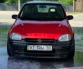 Красный Опель Корса, объемом двигателя 1.4 л и пробегом 200 тыс. км за 1500 $, фото 1 на Automoto.ua