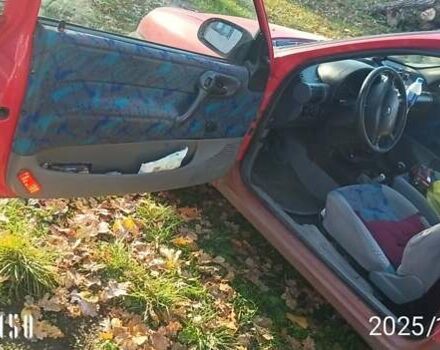 Красный Опель Корса, объемом двигателя 1.2 л и пробегом 222 тыс. км за 1318 $, фото 4 на Automoto.ua