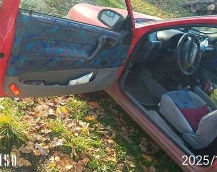 Красный Опель Корса, объемом двигателя 1.2 л и пробегом 140 тыс. км за 1400 $, фото 4 на Automoto.ua