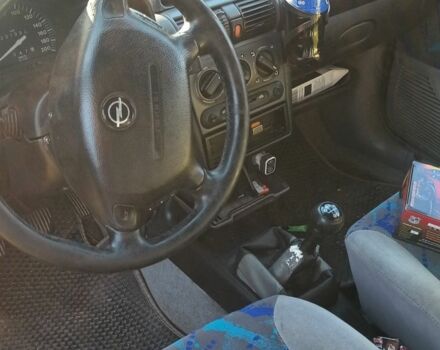 Красный Опель Корса, объемом двигателя 1.2 л и пробегом 222 тыс. км за 1318 $, фото 6 на Automoto.ua