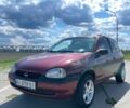 Красный Опель Корса, объемом двигателя 1.2 л и пробегом 235 тыс. км за 2200 $, фото 1 на Automoto.ua