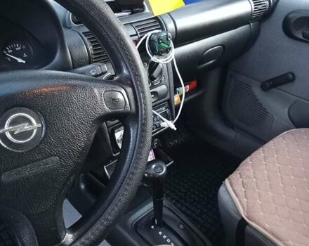 Красный Опель Корса, объемом двигателя 1.2 л и пробегом 130 тыс. км за 2800 $, фото 5 на Automoto.ua