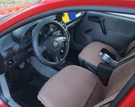 Красный Опель Корса, объемом двигателя 1.2 л и пробегом 130 тыс. км за 2800 $, фото 6 на Automoto.ua