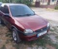 Красный Опель Корса, объемом двигателя 1.2 л и пробегом 220 тыс. км за 2200 $, фото 1 на Automoto.ua